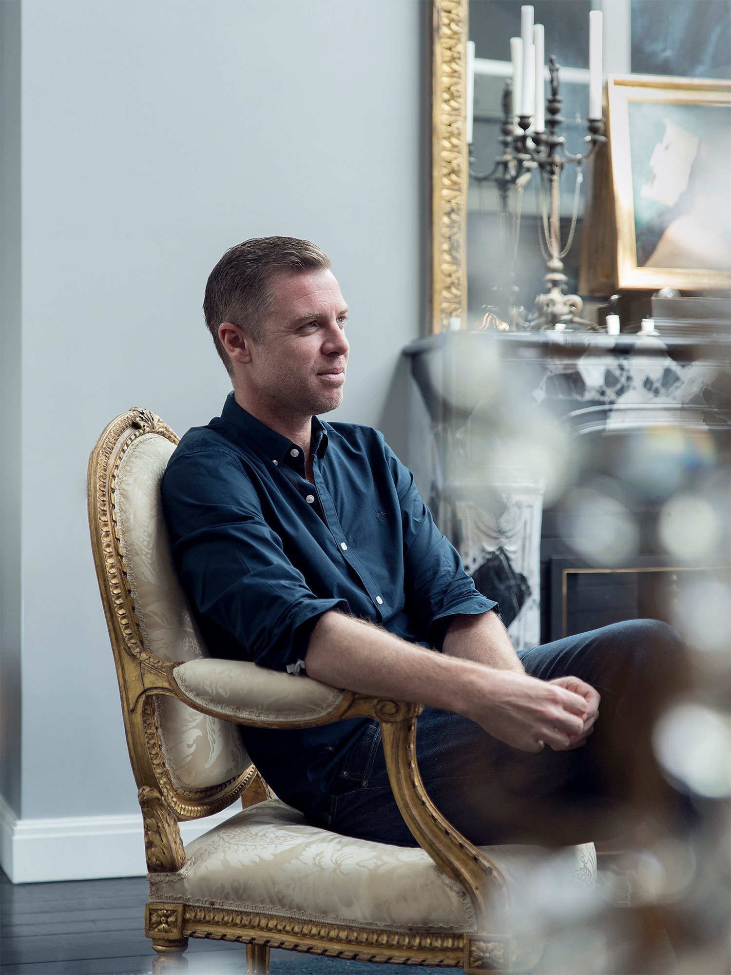 French Designer Jean-Louis Deniot Sitting in a Waldorf Astoria Antique Chair